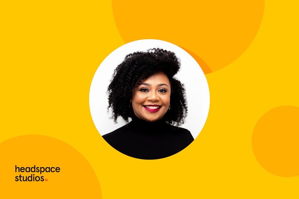 Photo of Dr. Joy against yellow background